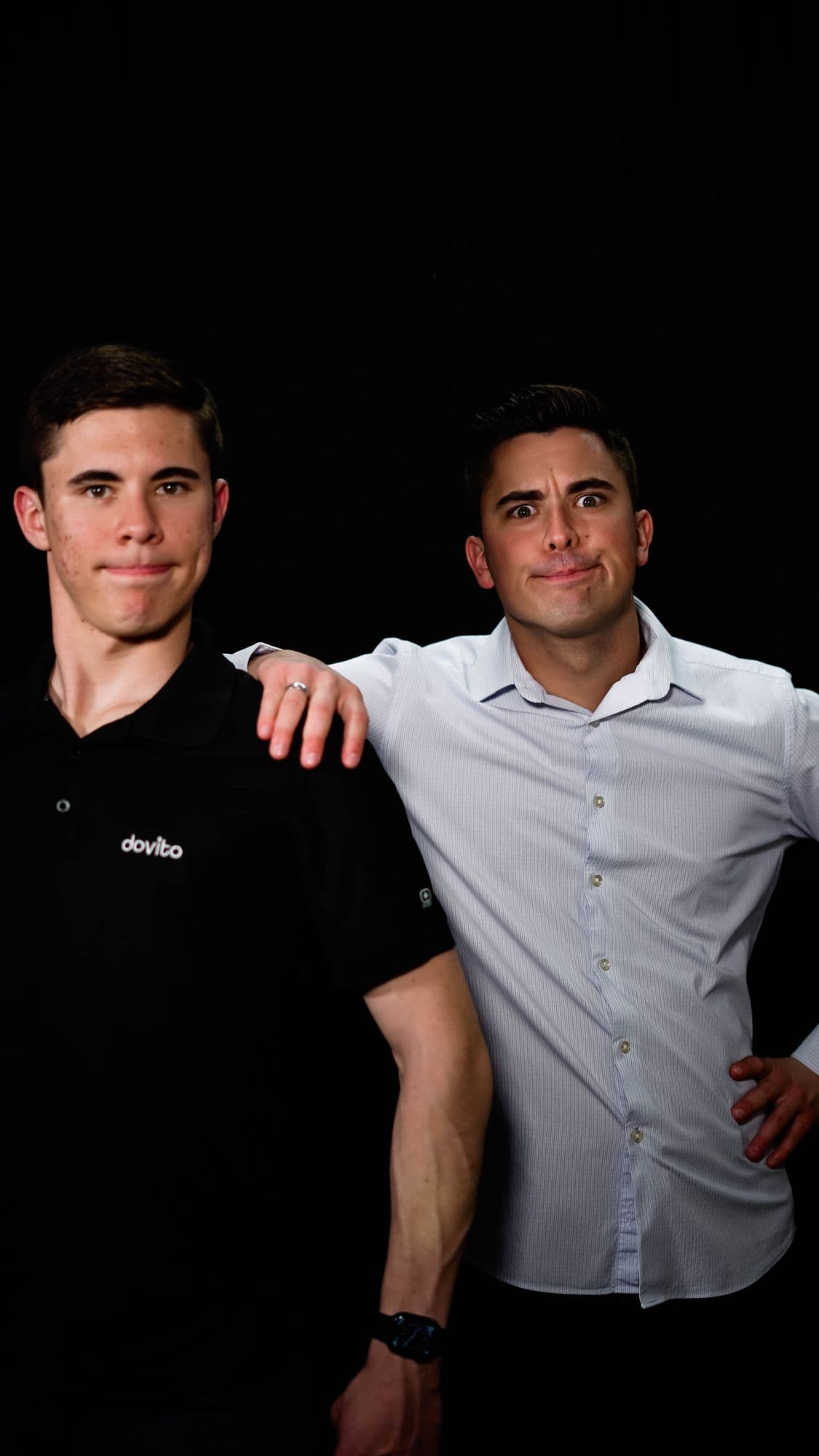 David and a teammate in a studio portrait