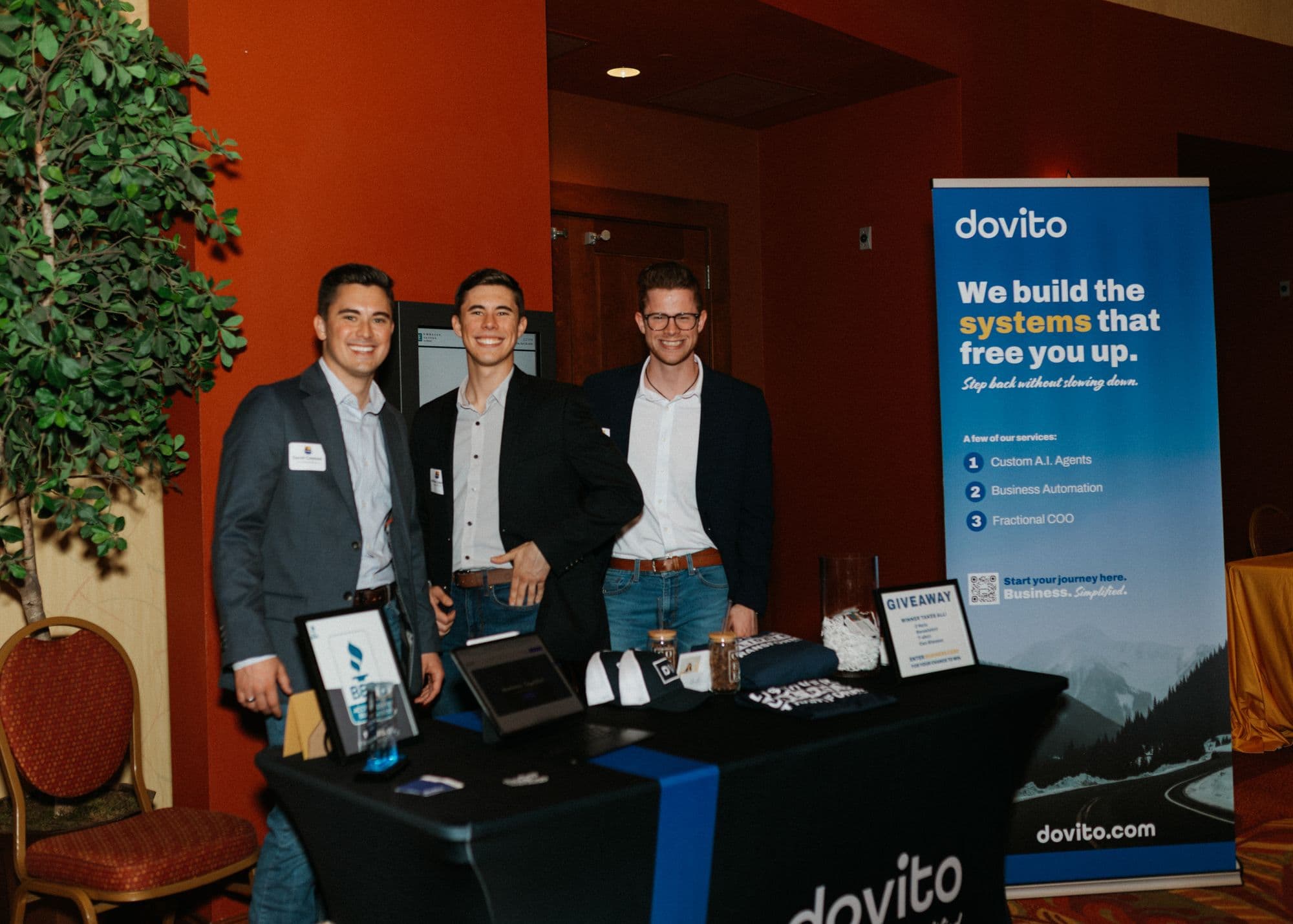 David and two teammates at a Dovito booth