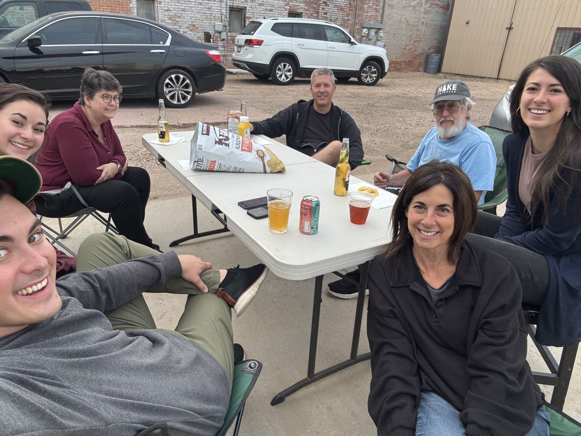 Family and friends around a table outside